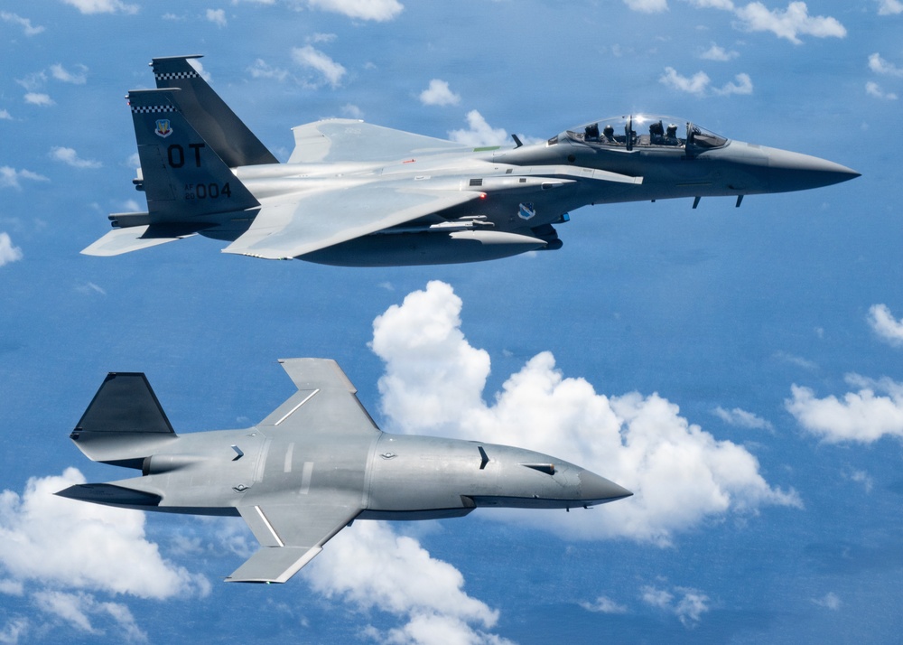 An MQ-28 Ghost Bat from Boeing Defense Australia and a U.S. Air Force F-15EX Eagle II participate in Valiant Shield 2026