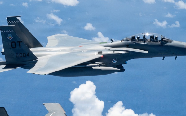 An MQ-28 Ghost Bat from Boeing Defense Australia and a U.S. Air Force F-15EX Eagle II participate in Valiant Shield 2026