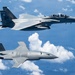An MQ-28 Ghost Bat from Boeing Defense Australia and a U.S. Air Force F-15EX Eagle II participate in Valiant Shield 2026