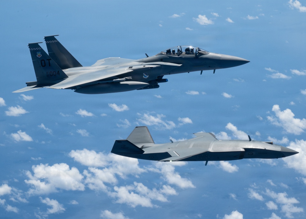 An MQ-28 Ghost Bat from Boeing Defense Australia and a U.S. Air Force F-15EX Eagle II participate in Valiant Shield 2026