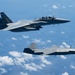 An MQ-28 Ghost Bat from Boeing Defense Australia and a U.S. Air Force F-15EX Eagle II participate in Valiant Shield 2026