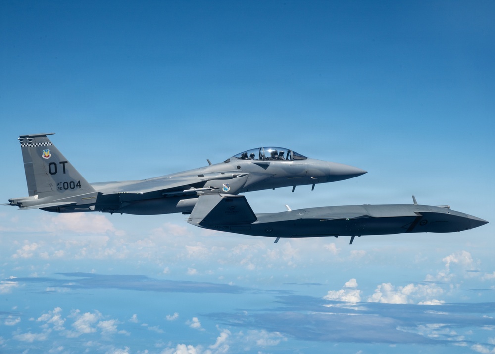 An MQ-28 Ghost Bat from Boeing Defense Australia and a U.S. Air Force F-15EX Eagle II participate in Valiant Shield 2026