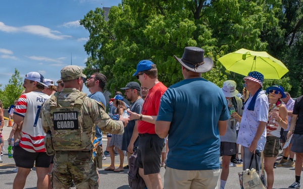 Mississippi National Guardsmen pass out water during America 250 heat wave