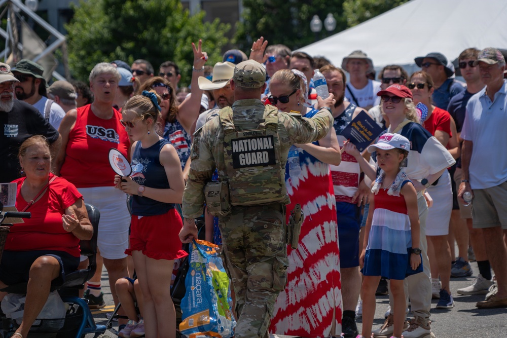 Mississippi National Guardsmen pass out water during America 250 heat wave