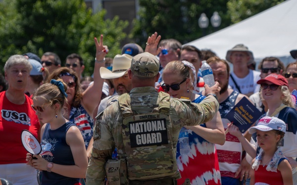 Mississippi National Guardsmen pass out water during America 250 heat wave