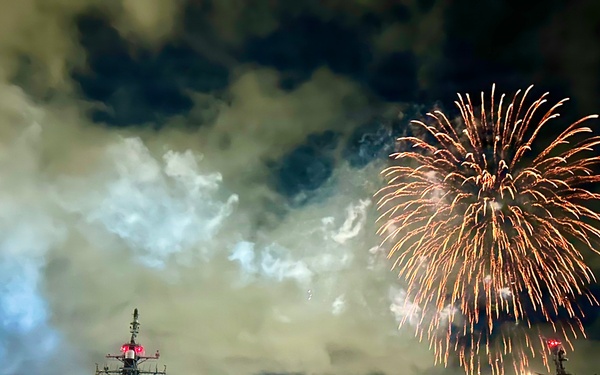 Fireworks illuminate JS KONGO during U.S. Independence Day celebrations