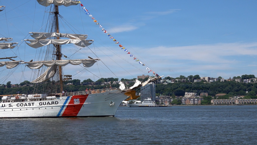 U.S. Coast Guard Cutter Eagle (WIX 327) displays signal flags as it transits the Hudson River near the Royal Moroccan Navy frigate RMNS Mohammed VI (701) during International Naval Review 250