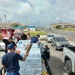 U.S. Coast Guard transports water in concert with damage assessments for port recovery