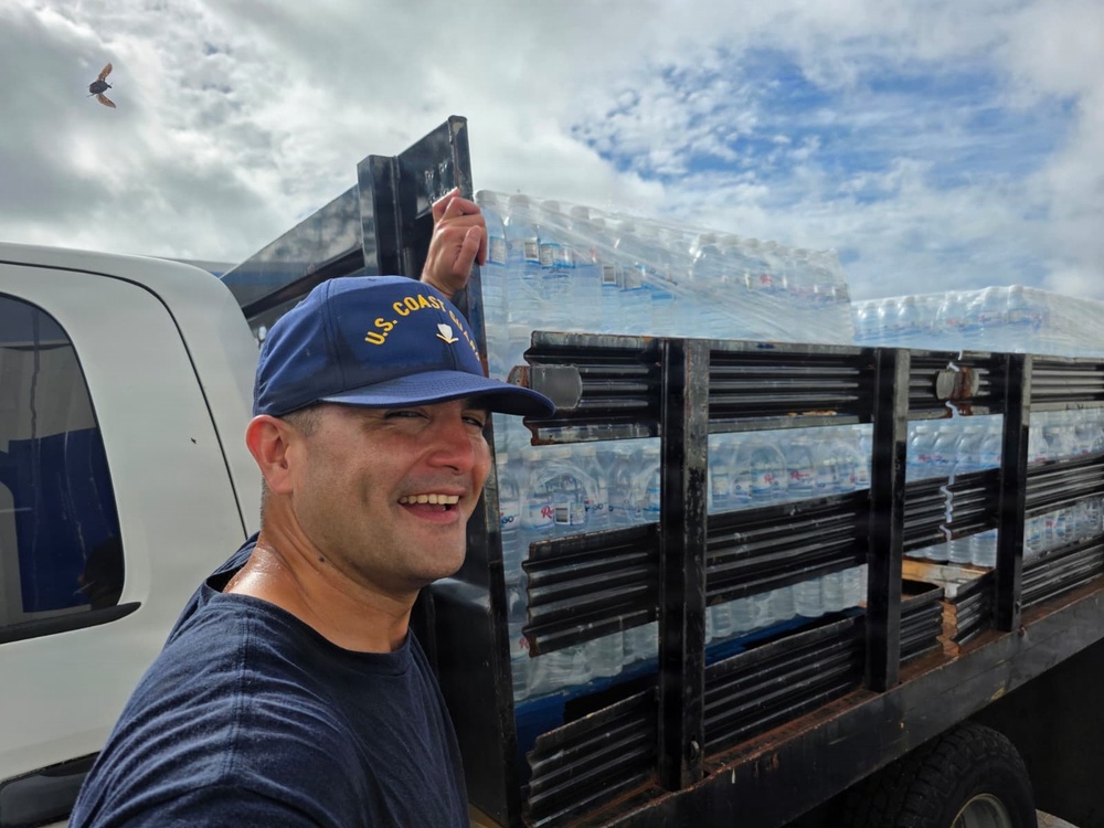 U.S. Coast Guard transports water in concert with damage assessments for port recovery