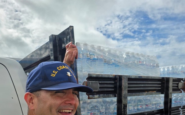 U.S. Coast Guard transports water in concert with damage assessments for port recovery