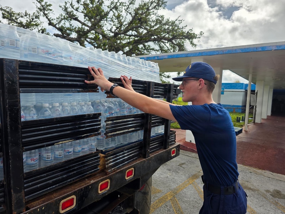 U.S. Coast Guard transports water in concert with damage assessments for port recovery