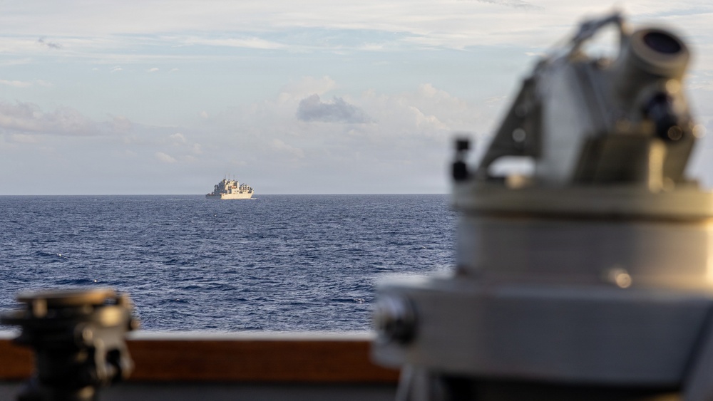 USS Mustin conducts a replenishment-at-sea with USNS Carl Brashear