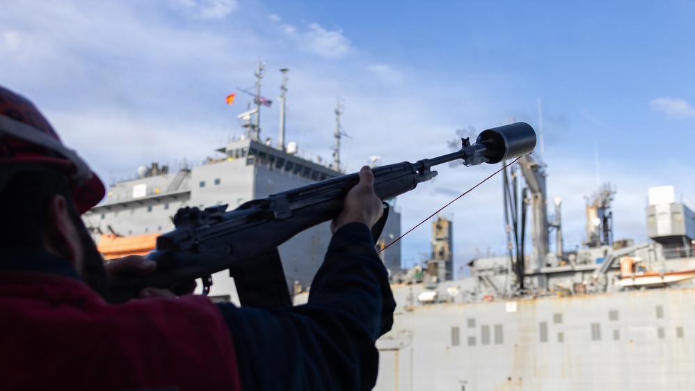 USS Mustin conducts a replenishment-at-sea with USNS Carl Brashear