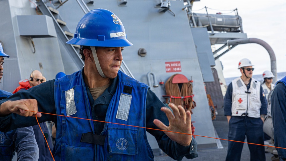 USS Mustin conducts a replenishment-at-sea with USNS Carl Brashear