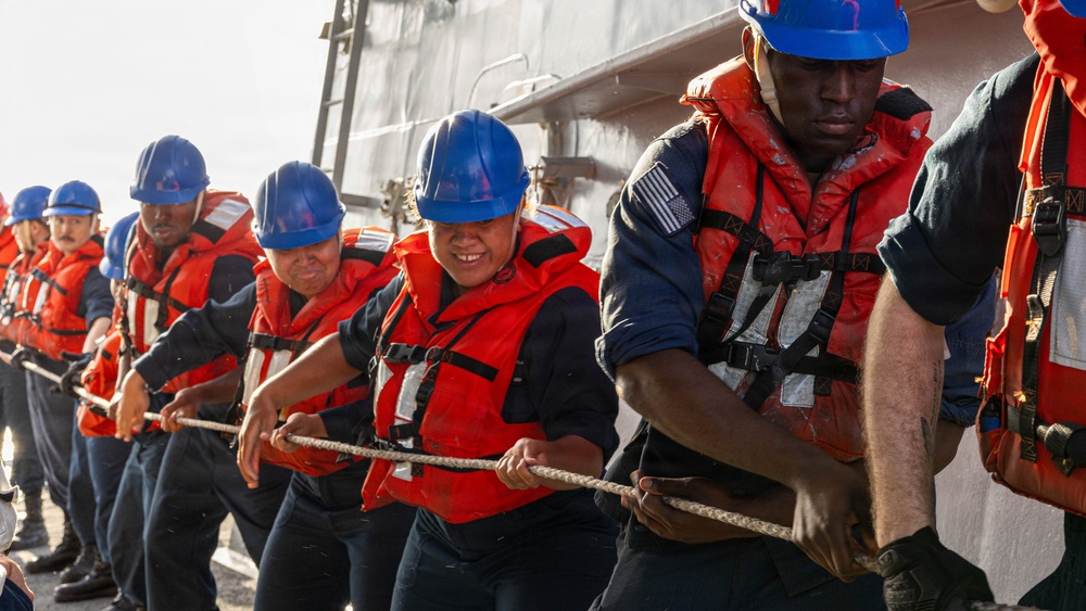 USS Mustin conducts a replenishment-at-sea with USNS Carl Brashear