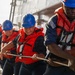 USS Mustin conducts a replenishment-at-sea with USNS Carl Brashear