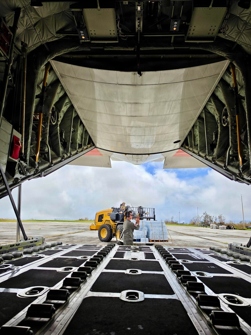 U.S. Coast Guard crew delivers assessment team, water to Rota for port recovery from Super Typhoon Bavi