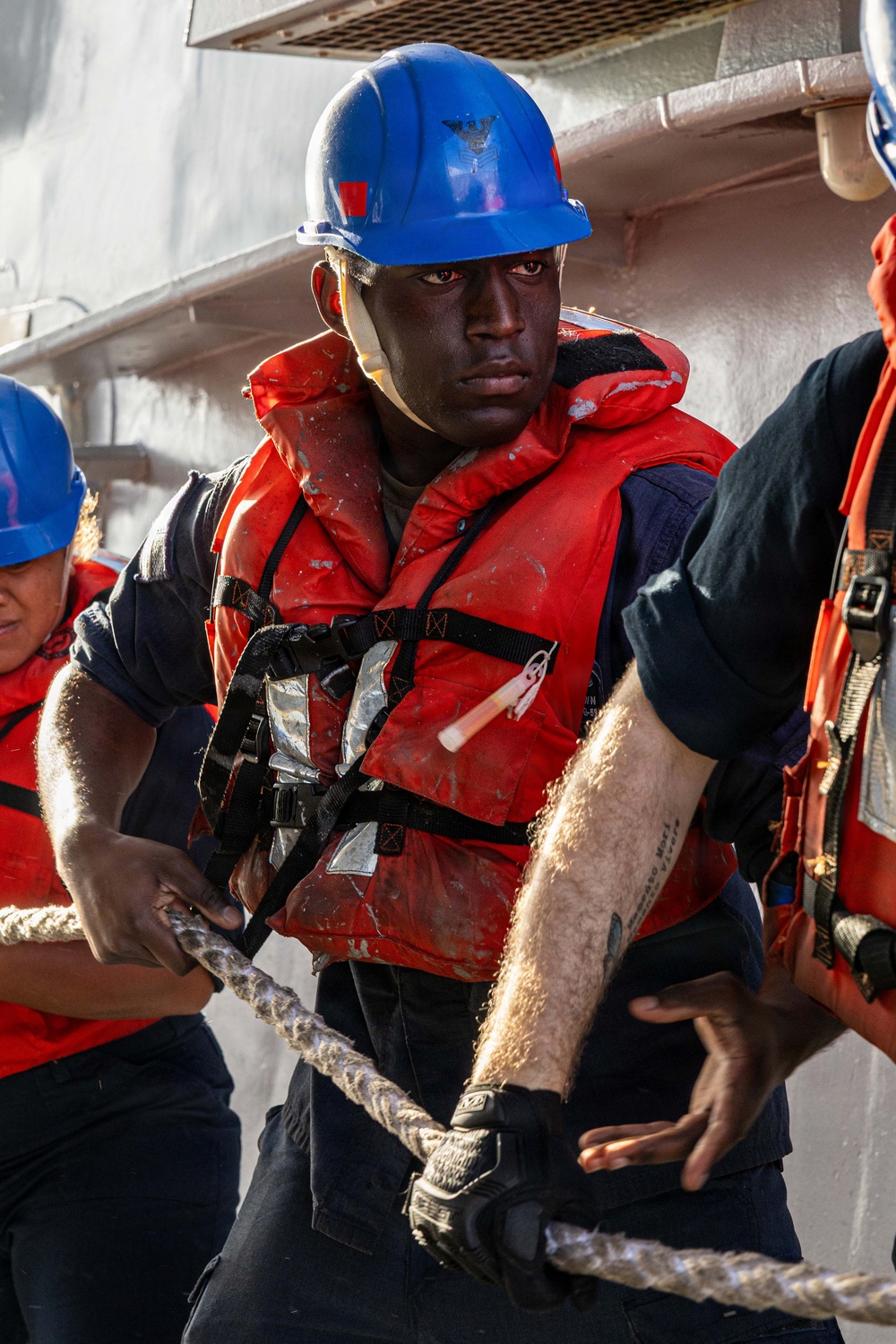 USS Mustin conducts a replenishment-at-sea with USNS Carl Brashear