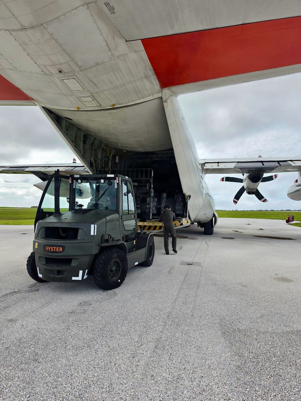U.S. Coast Guard crew delivers assessment team, water to Rota for port recovery from Super Typhoon Bavi