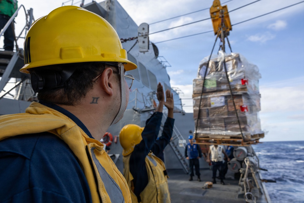 USS Mustin conducts a replenishment-at-sea with USNS Carl Brashear