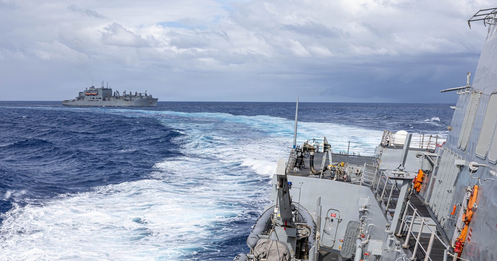 USS Mustin conducts a replenishment-at-sea with USNS Carl Brashear