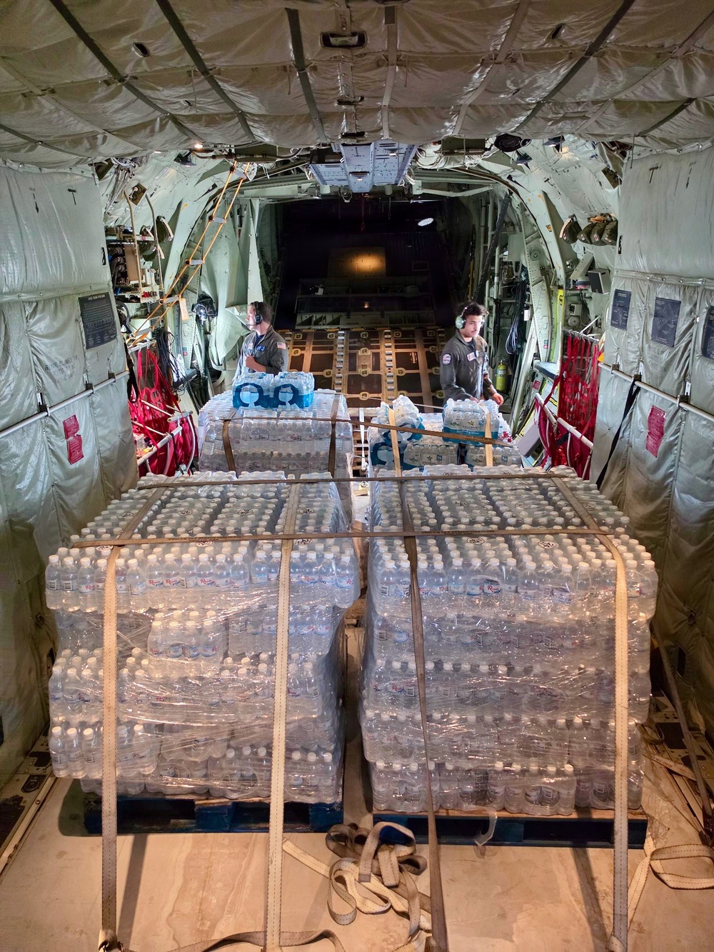 U.S. Coast Guard crew delivers assessment team, water to Rota for port recovery from Super Typhoon Bavi