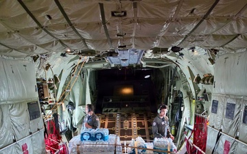 U.S. Coast Guard crew delivers assessment team, water to Rota for port recovery from Super Typhoon Bavi