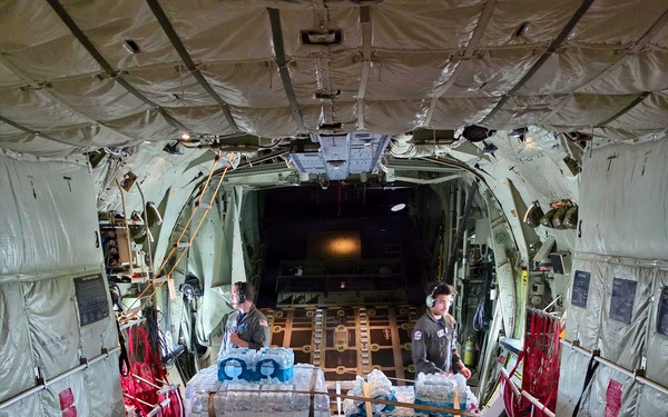 U.S. Coast Guard crew delivers assessment team, water to Rota for port recovery from Super Typhoon Bavi