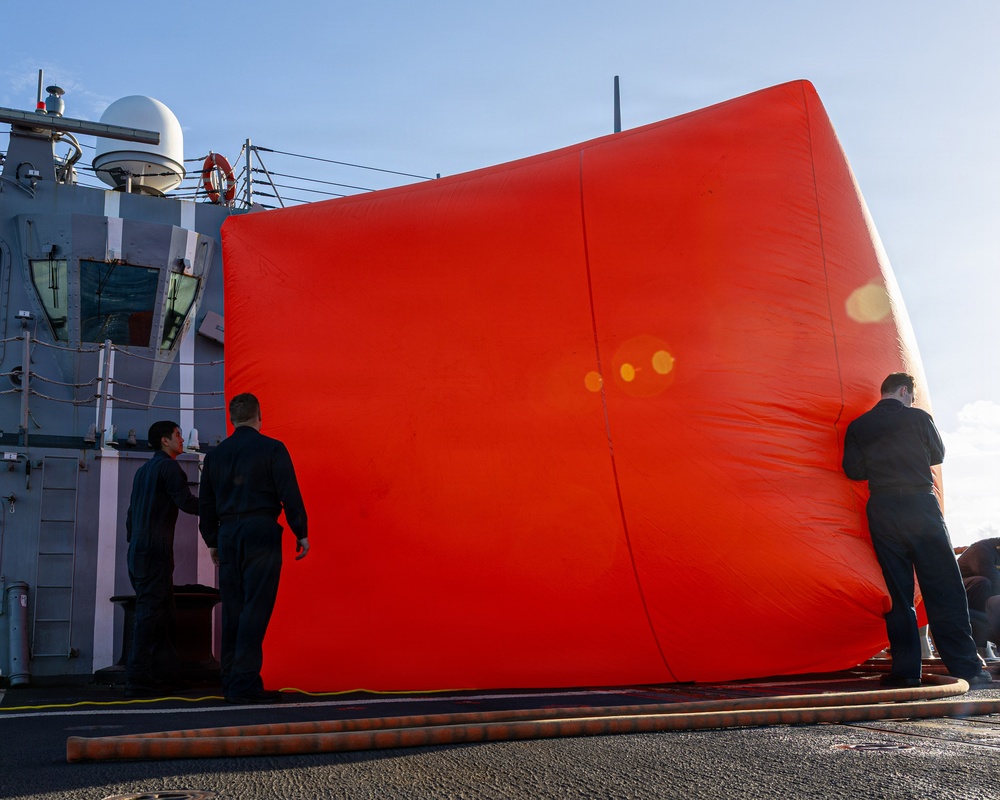 USS Mustin conducts a “killer tomato” inflatable surface target live-fire exercise