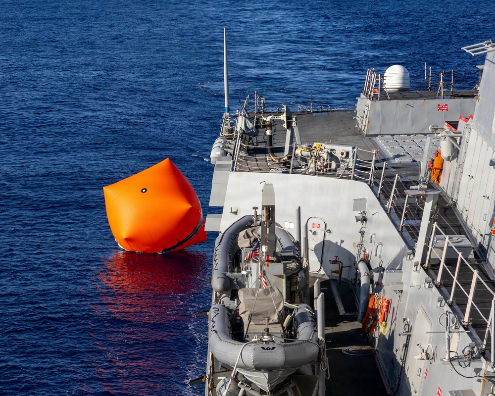 USS Mustin conducts a “killer tomato” inflatable surface target live-fire exercise