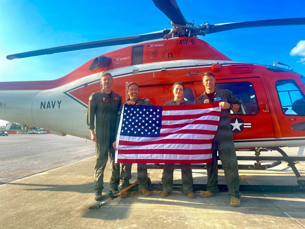 Naval Flight Officers assigned to Training Air Wing (TW) 6 located at Naval Air Station (NAS) Pensacola and Naval Aviators assigned to TW-5 located at NAS Whiting Field, participate in a flyover of the Symphony Sparks &amp; Stars, July 4