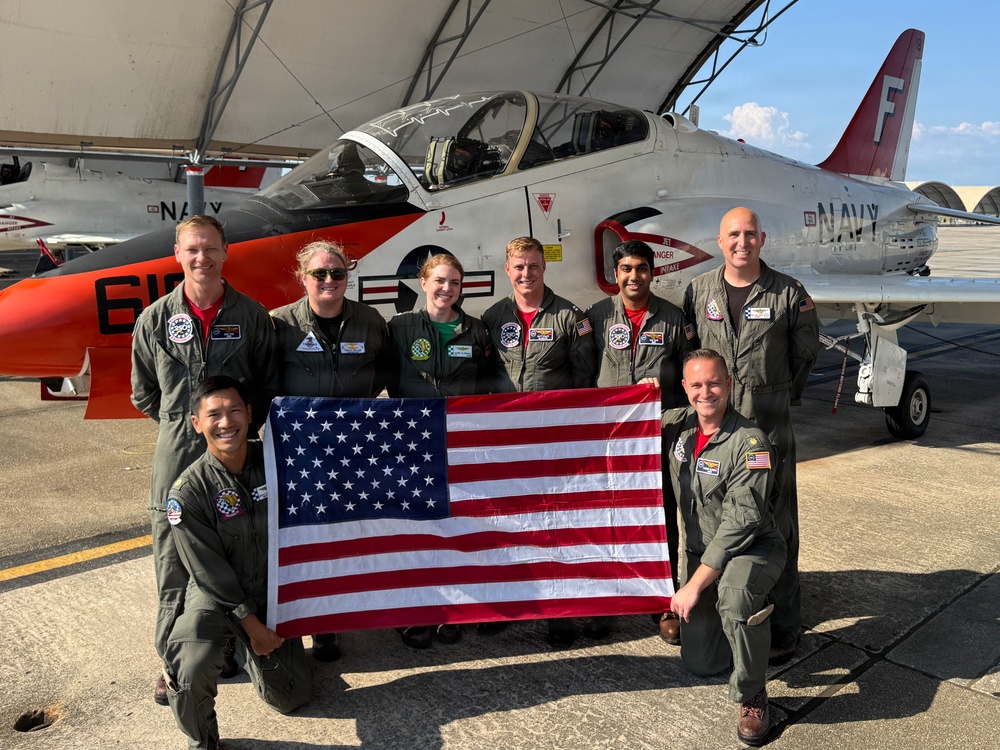 Naval Flight Officers assigned to Training Air Wing (TW) 6 located at Naval Air Station (NAS) Pensacola and Naval Aviators assigned to TW-5 located at NAS Whiting Field, participate in a flyover of the Symphony Sparks &amp; Stars, July 4