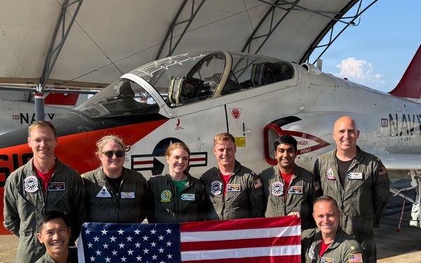 Naval Flight Officers assigned to Training Air Wing (TW) 6 located at Naval Air Station (NAS) Pensacola and Naval Aviators assigned to TW-5 located at NAS Whiting Field, participate in a flyover of the Symphony Sparks &amp; Stars, July 4