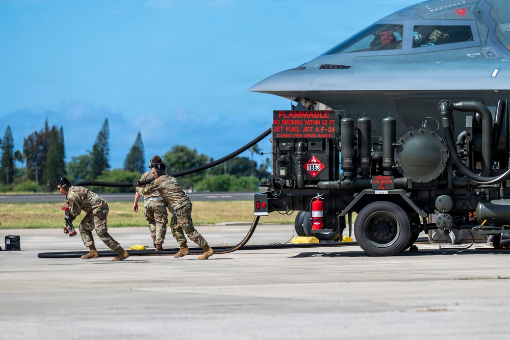 Two B-2 Spirits hot-pit at Joint Base Pearl Harbor-Hickam during BTF deployment