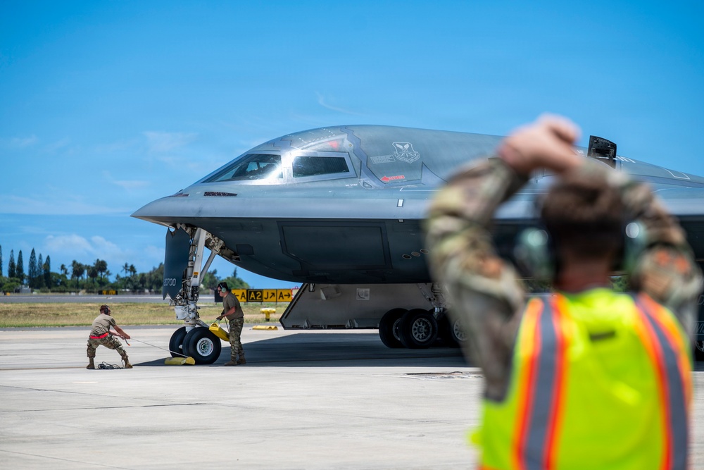 Two B-2 Spirits hot-pit at Joint Base Pearl Harbor-Hickam during BTF deployment