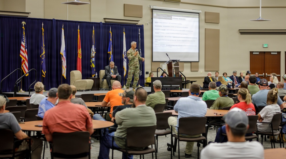 Col. Aaron Cornett speaks with Crane Army Ammunition Activity Staff Members