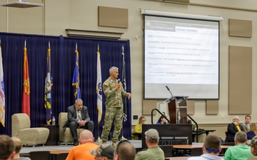 Col. Aaron Cornett speaks with Crane Army Ammunition Activity Staff Members