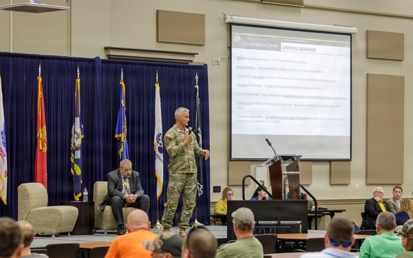 Col. Aaron Cornett speaks with Crane Army Ammunition Activity Staff Members