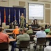 Col. Aaron Cornett speaks with Crane Army Ammunition Activity Staff Members