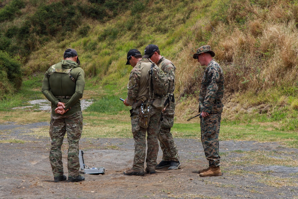 Multinational explosive ordnance disposal technicians conduct ordnance exploitation training during RIMPAC 26
