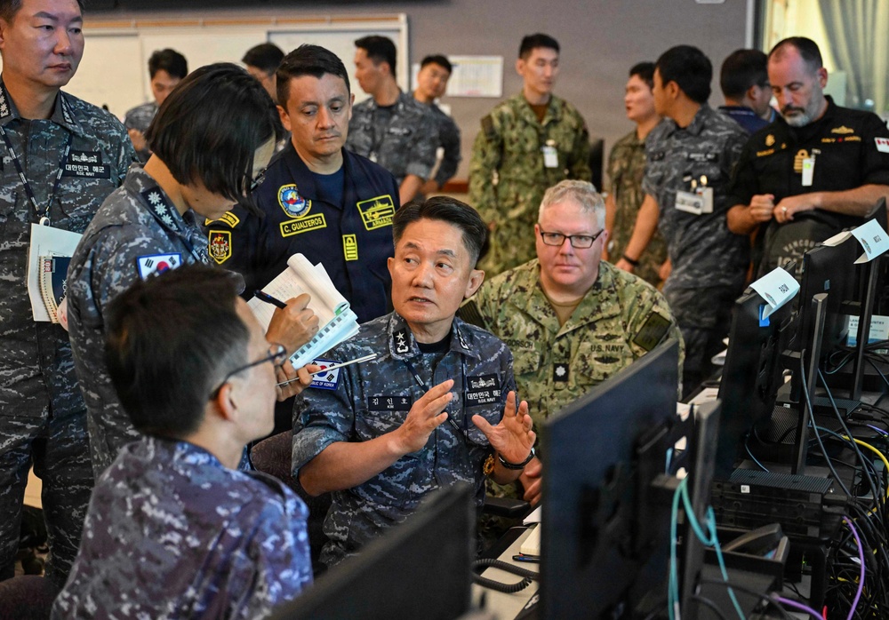 Multinational partners participate in the commander's update briefing RIMPAC 2026