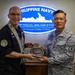 BRP Miguel Malvar commanding officer receives a memento from HMCS Regina's skipper