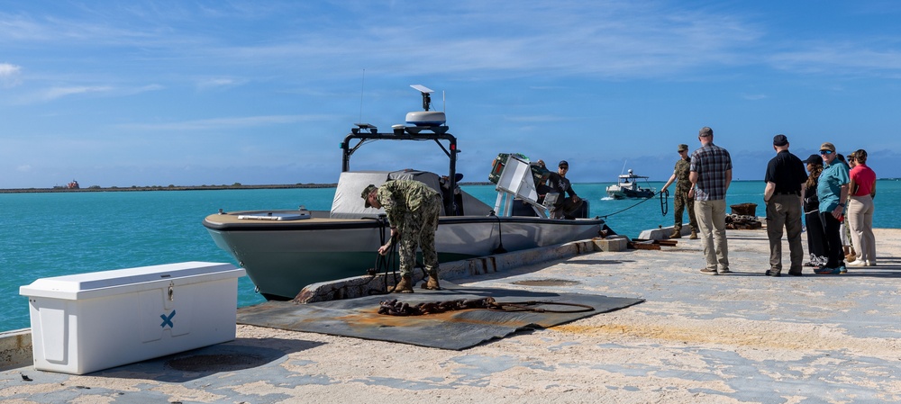 U.S. Sailor and Marine unmoor a surface vessel during RIMPAC 26