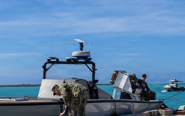 U.S. Sailor and Marine unmoor a surface vessel during RIMPAC 26
