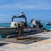 U.S. Sailor and Marine unmoor a surface vessel during RIMPAC 26