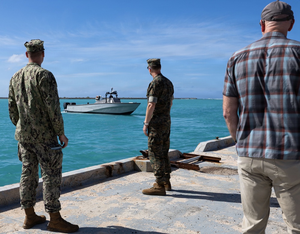 U.S. Sailor and Marine watch surface vessel depart during RIMPAC 26
