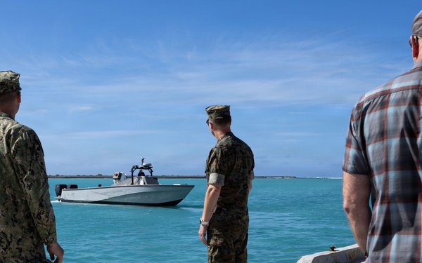 U.S. Sailor and Marine watch surface vessel depart during RIMPAC 26