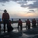 USS Tripoli Conducts A Sunrise Gun Shoot