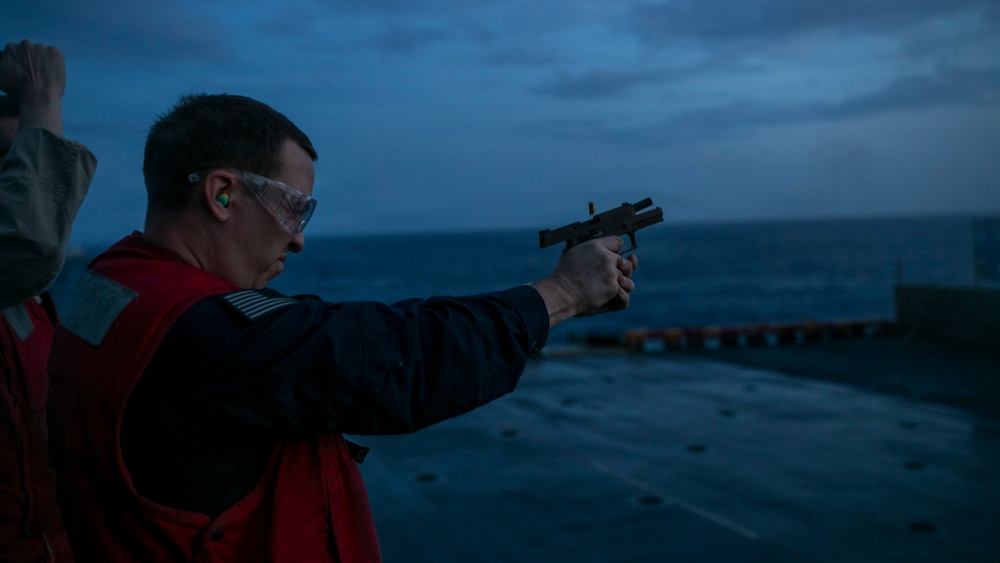 USS Tripoli Conducts A Sunrise Gun Shoot