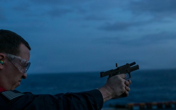 USS Tripoli Conducts A Sunrise Gun Shoot